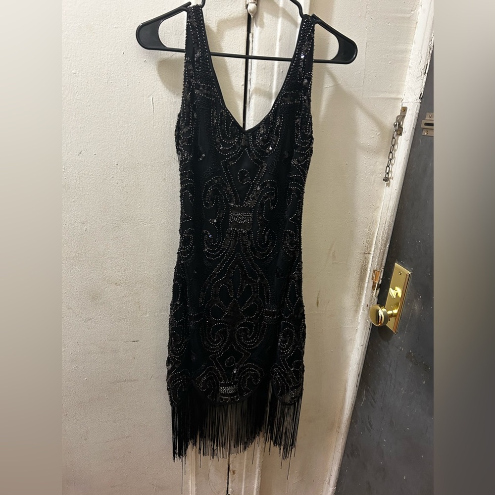 Gently used black beaded mini dress with black fringe size M